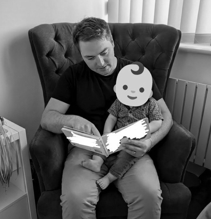 Ben, Dad & Founder of Little Town Tales, reading a storybook with his son